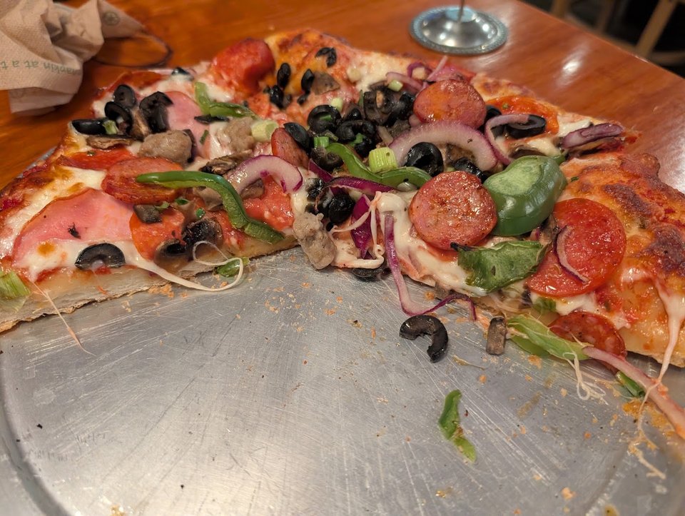 Pizza restaurant interior with simple seating.