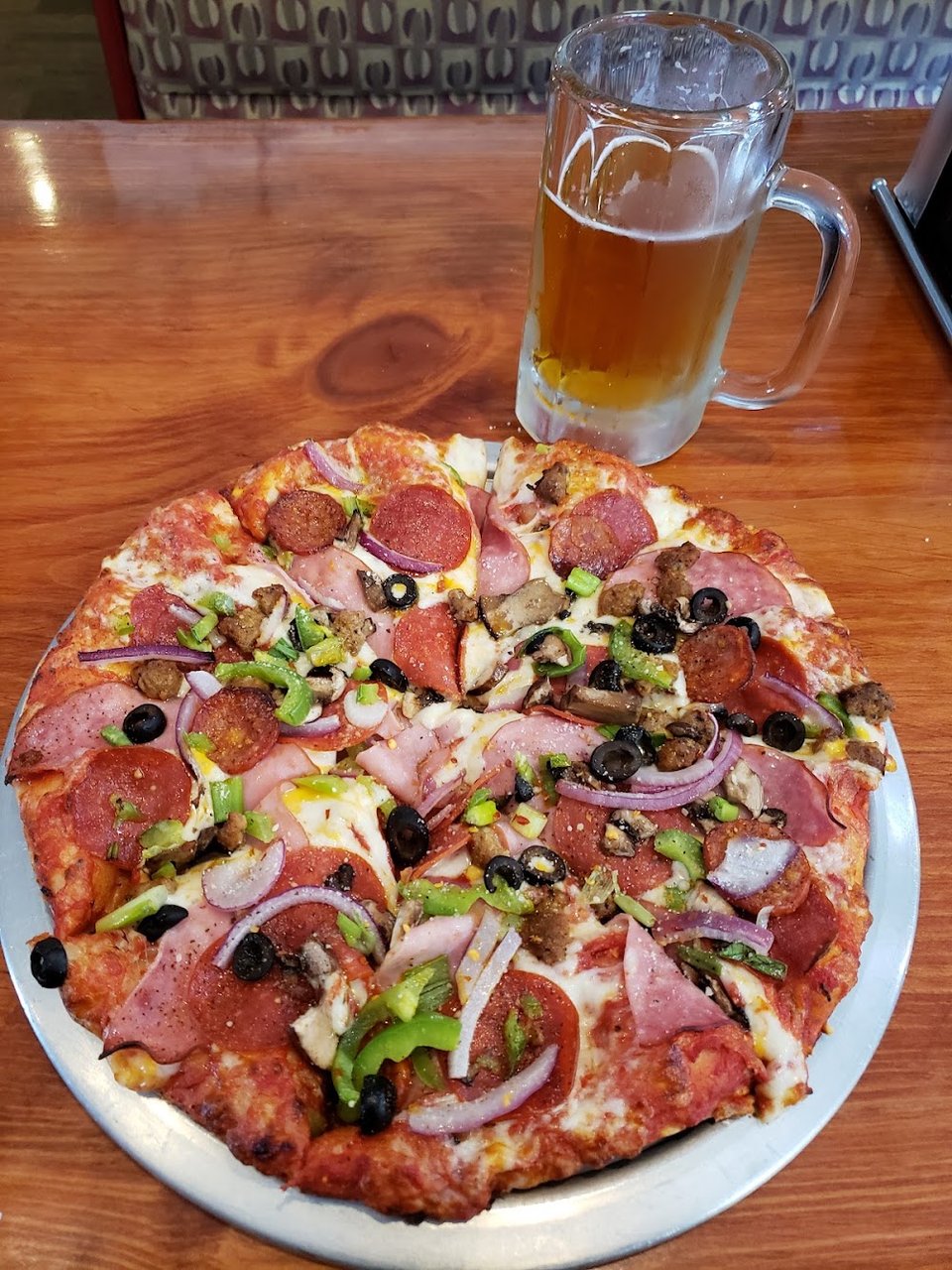 Restaurant menu with beer, soda, and garlic bread.