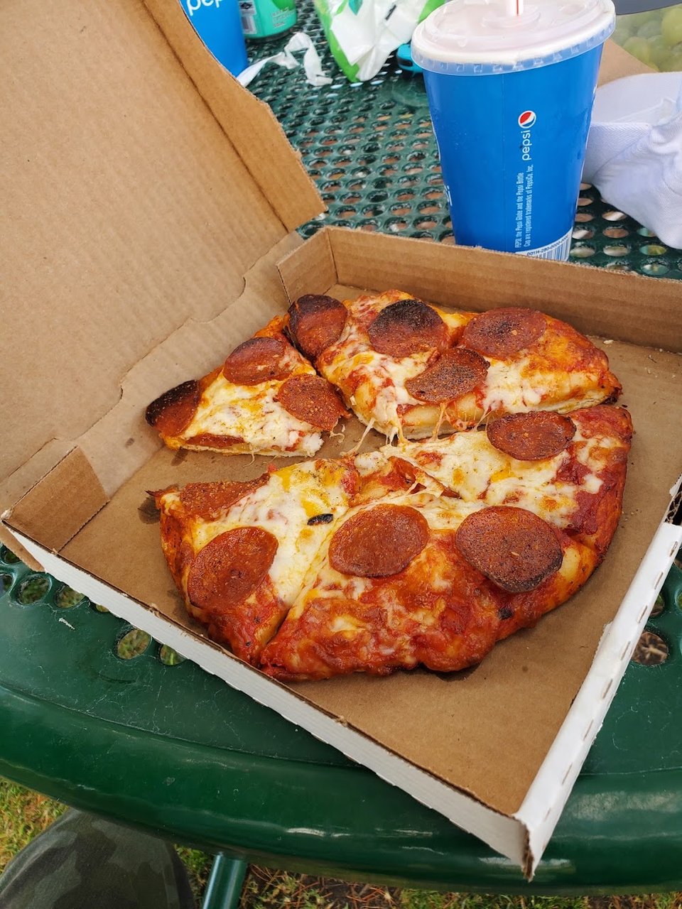 Close-up of a pizza menu section.